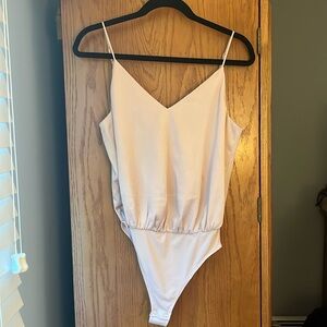 Express Champagne Pink bodysuit size small. NWOT!